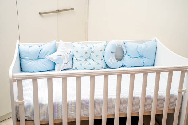 Baby crib with blue pillows