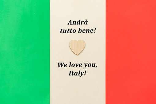 Words of support and solidarity with the people of Italy and symbolic heart against the backdrop of the national Italian flag.