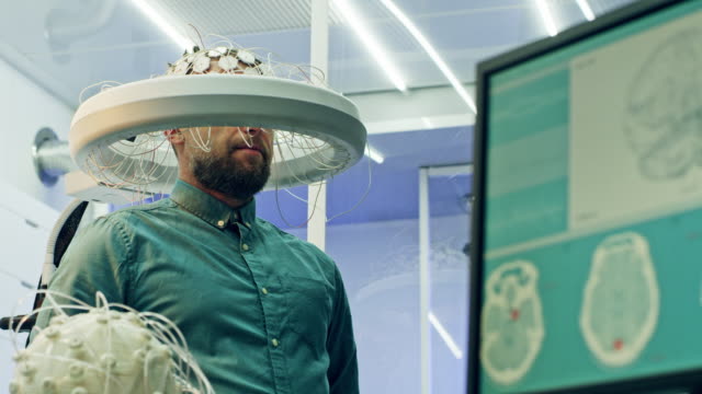 Man Wearing Brainwave Scanning Headset.