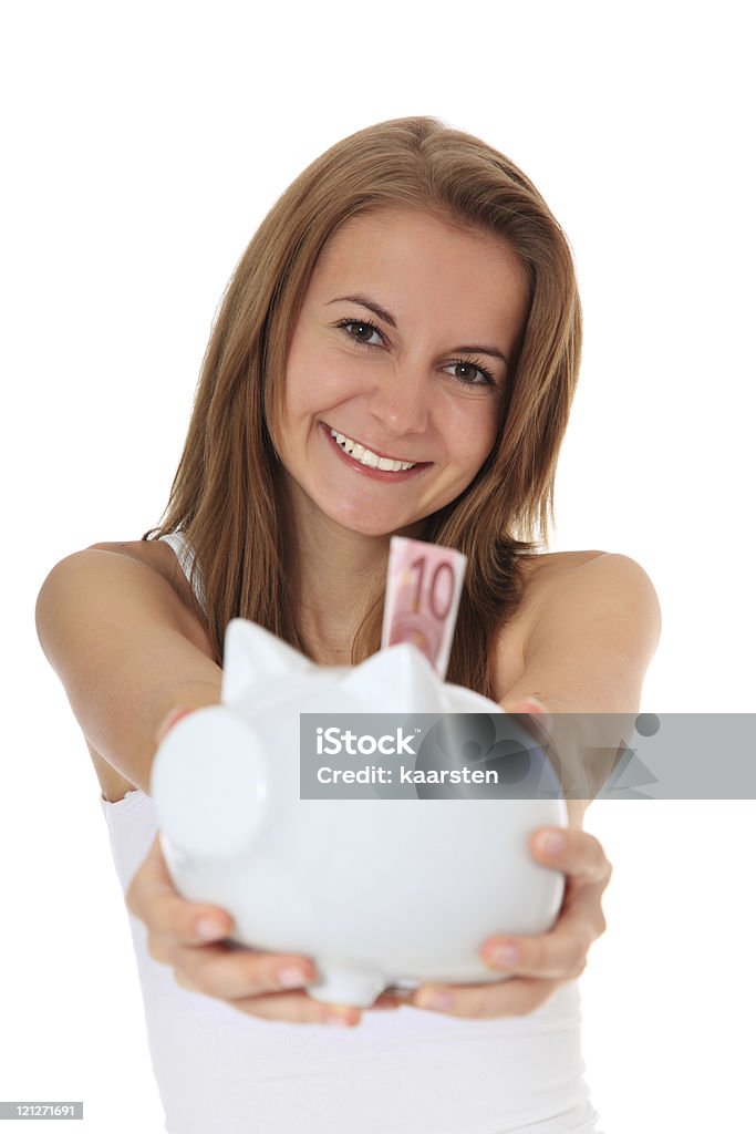 Attractive girl holding alcancía - Foto de stock de Actividades bancarias libre de derechos