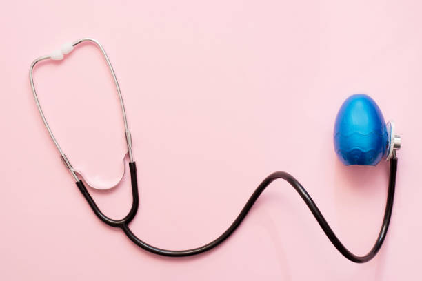 istock Stethoscope close up to blue easter egg on pink background with a copy space 1212721442