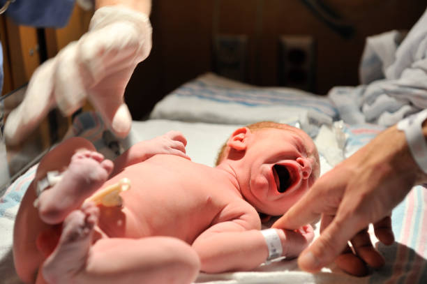 istock A new born baby kicking and crying 121272170