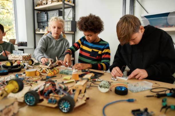istock Enhancing the future. Young technicians making toys at a technology class. Smart kids and STEM education. 1212721911