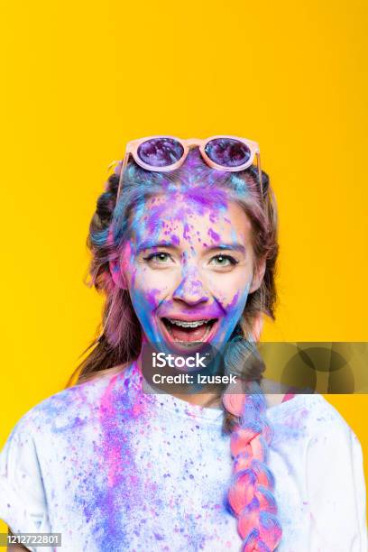 Portrait Of Excited Teenage Girl Covered In Holi Powder Stock Photo - Download Image Now