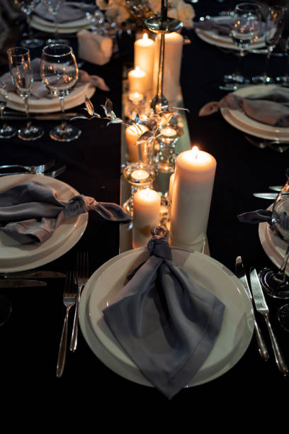 istock festive table setting candles for wedding party 1212726693