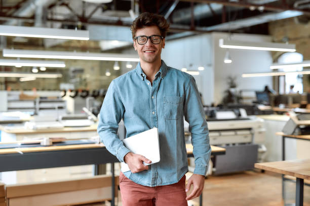 istock Keep calm and work hard. Young businessman posing in office 1212727828
