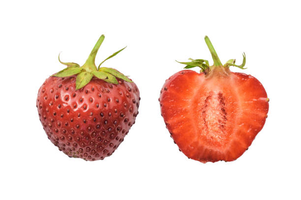 istock Halved ripe strawberries isolated on a white background 1212728337