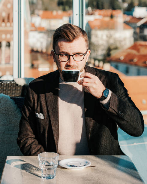 istock One caucasian man drinking coffee from cup and cafe 1212728388