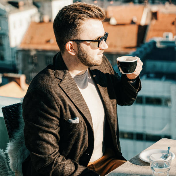 istock One caucasian man drinking coffee from cup at cafe 1212728393