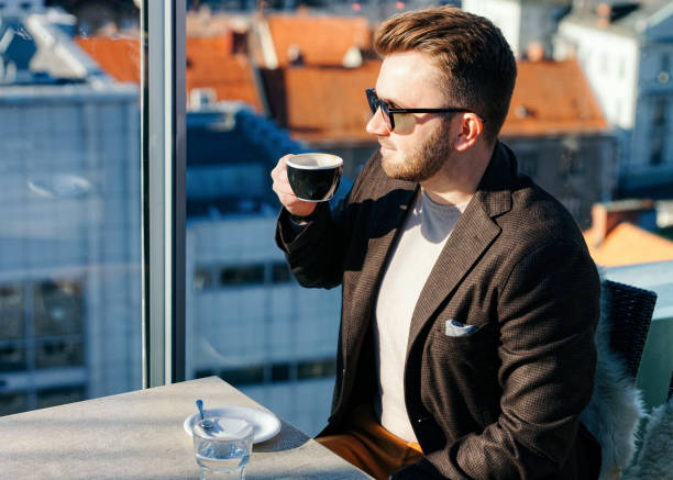 istock One caucasian man drinking coffee from cup in cafe 1212728407