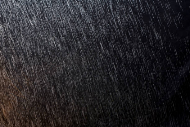 istock abstract rain texture background. background rain in night light 1212729117