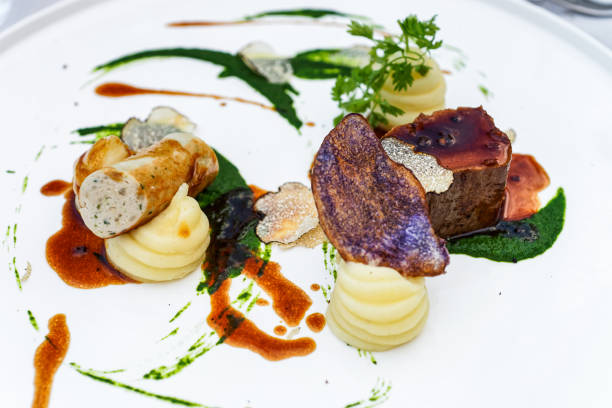 istock Truffle with steak and vegetables on white plate 1212729396
