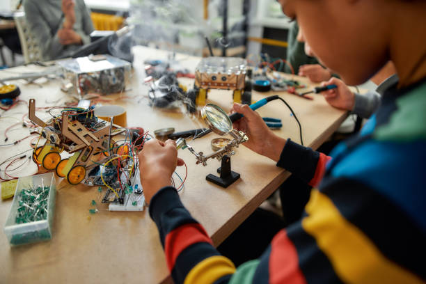 istock There is no impossible. Cropped shot of young engineer using soldering iron to join chips and wires. Robotics and software engineering for elementary students. Inventions and creativity for kids 1212731944