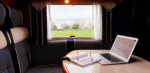 istock Motorhome Mobile office at the seaside 1212732308