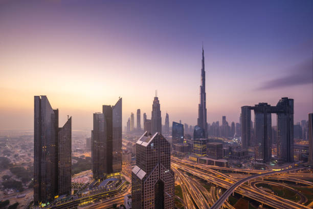 Urban skyline and cityscape at sunrise in Dubai UAE. stock photo