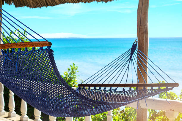 istock Relaxing in the classic blue color hammock. 1212735946
