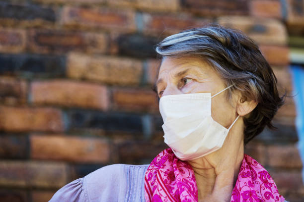 istock Senior woman wearing a mask to avoid infection during the COVID-19 coronavirus epidemic 1212740607