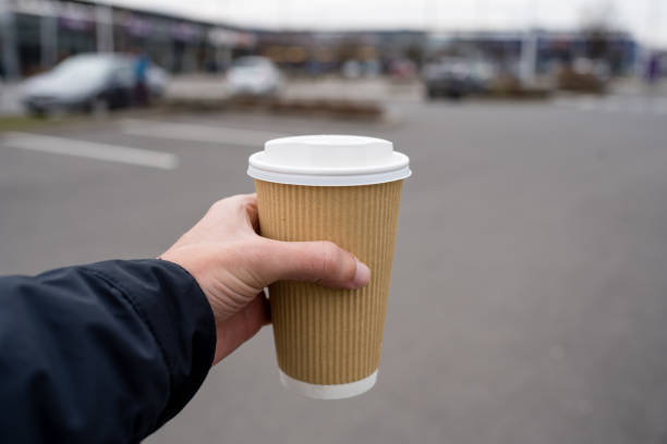 istock Holding a cup of a drink 1212741359