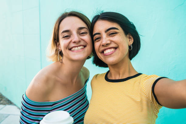 istock Lovely lesbian couple taking a selfie. 1212742227