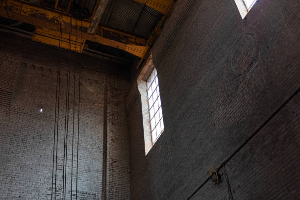 istock High window illuminating a brick interior of an industrial site 1212742241