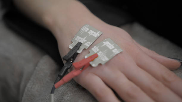istock Two electronic sensors on a female hand, red and black 1212743009