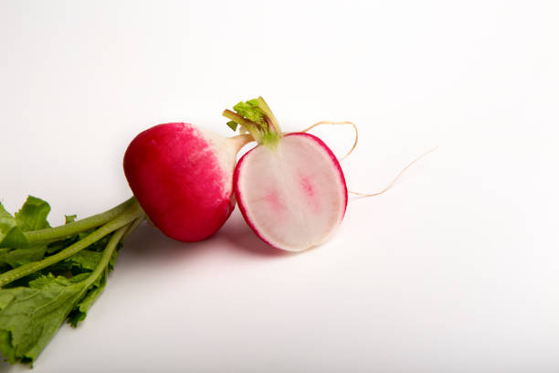 istock Organic vegetable nutrition. Fresh ripe radish on white background 1212743236