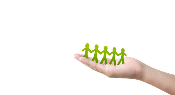 istock Human shape in paper cut with hand by hand or shake hand in hand 1212743814