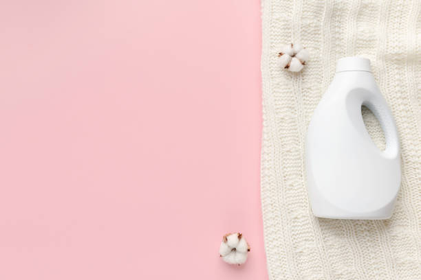 istock Bio plastic Bottle with washing detergent and cotton flowers 1212743823