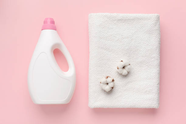 istock White plastic packaging of laundry detergent, cotton flowers 1212743888