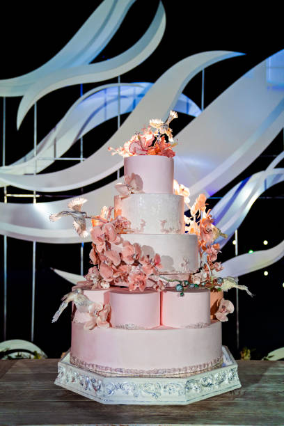 istock multi-tiered wedding cake sugar flowers and birds 1212745941
