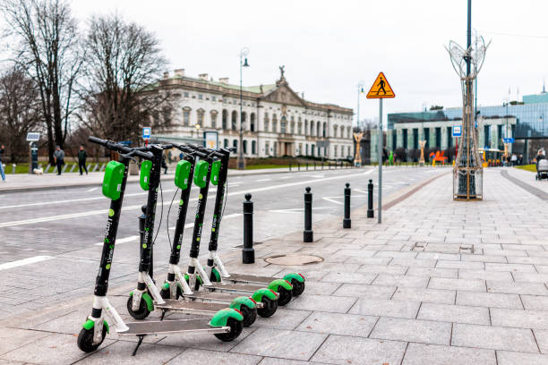 Lime electric scooter rental outside on street outdoors parked on street sidewalk in Warsaw Warsaw, Poland - December 25, 2019: Lime electric scooter rental outside on street outdoors parked on street sidewalk in downtown with nobody in Warszawa lime scooter stock pictures, royalty-free photos & images