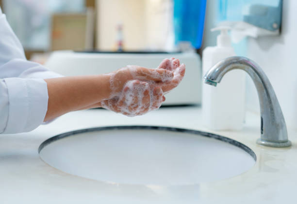 istock Hygiene Concept, Washing hands with soap in a clinic 1212746679