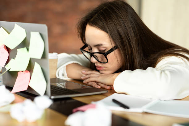 istock Freelance girl put head on table and sleeps 1212747528