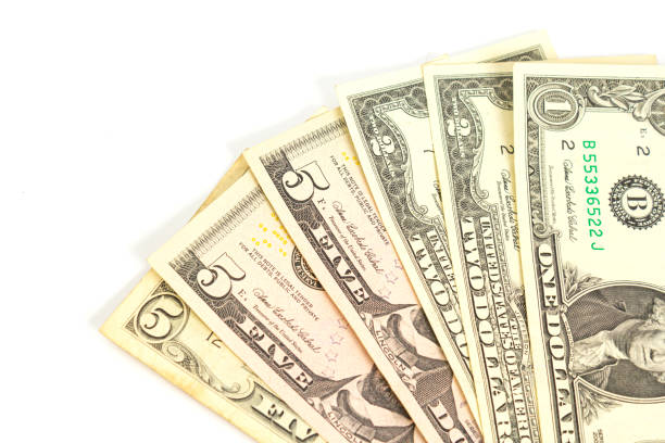 istock a fan of one two and five dollar bills on a white background. isolate. close up 1212748241