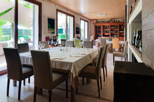 Retro restaurant interior wine shelves and tables with chairs
