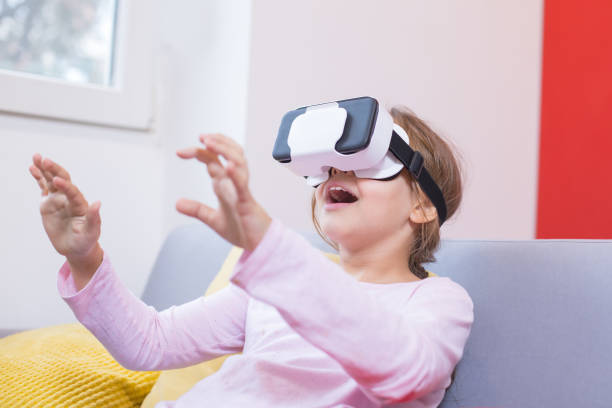 istock young girl using virtual reality goggles at home 1212750713