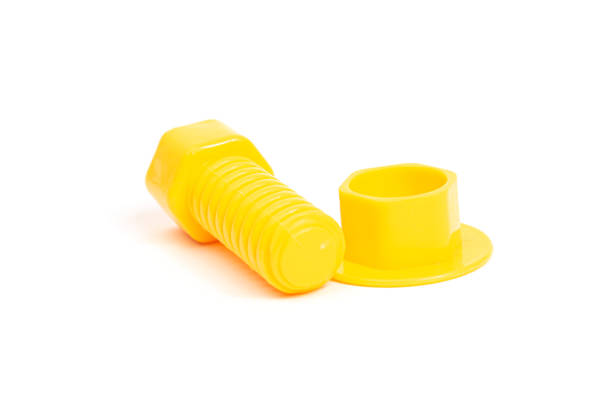istock yellow toy bolt and nut on a white background isolate, side view 1212752330