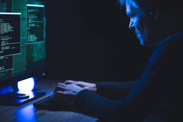 istock Typing on a keyboard with data on a monitor 1212752440