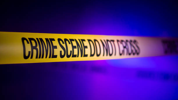 istock Crime Scene Tape Don't Cross 1212755230