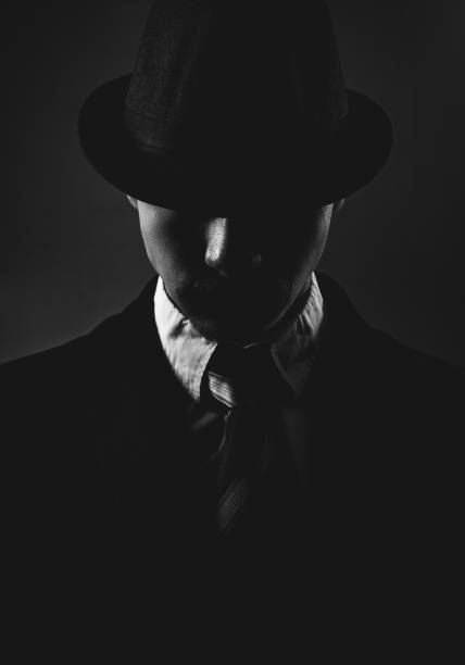 istock Retro man in hat wears suit and tie 1212755638