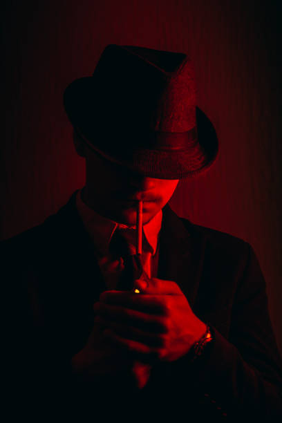 istock Retro man in hat wears suit and tie 1212755892