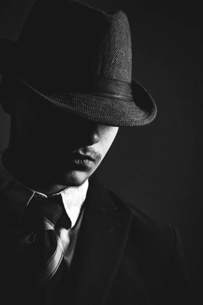 istock Retro man in hat wears suit and tie 1212755936