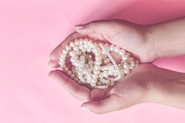 Human hands with long fingernail and beautiful manicure over white background