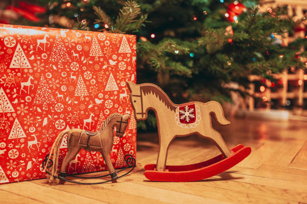 istock Christmas decorations for equestrian centres and wrapped present under a Christmas tree 1212756785