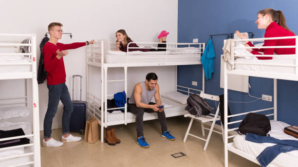 istock Travelers resting in hostel bedroom 1212759194