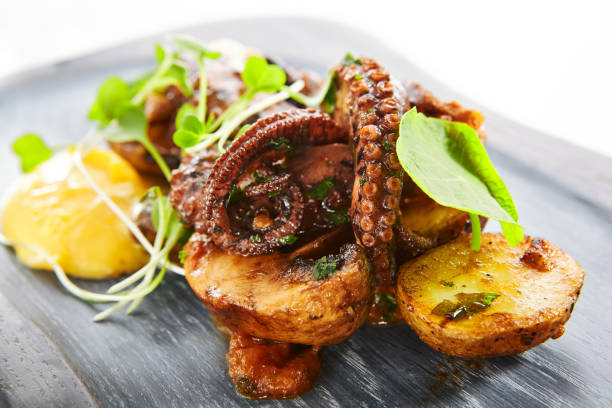 istock Grilled octopus with baked potatoes 1212759275