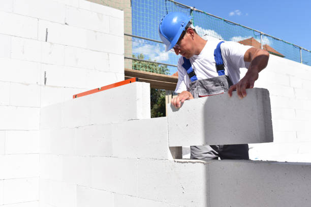 istock profession construction worker - work on a building site construction of a residential house 1212759549