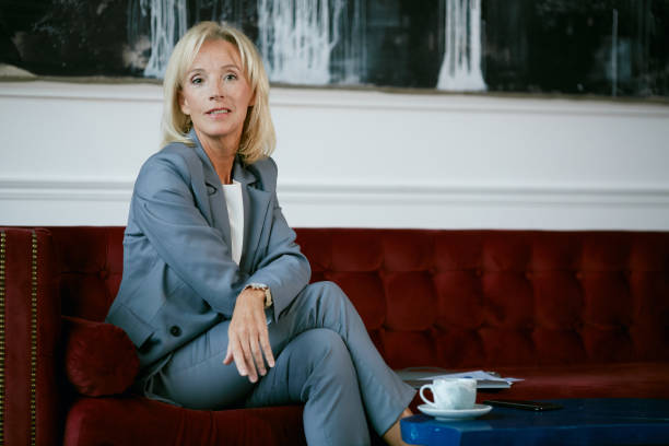 istock Elegant Mature Woman Posing in Cafe 1212759572