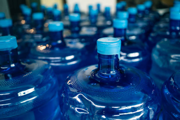 a pile of large drinking water bottles - plastic chemical warehouse industry imagens e fotografias de stock