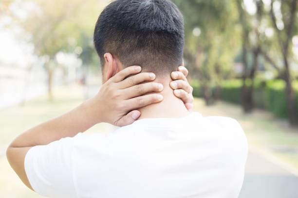 istock Men have neck pain while running in the park. 1212760492